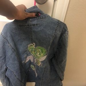 Long denim jacket with cute floral design right on the back!